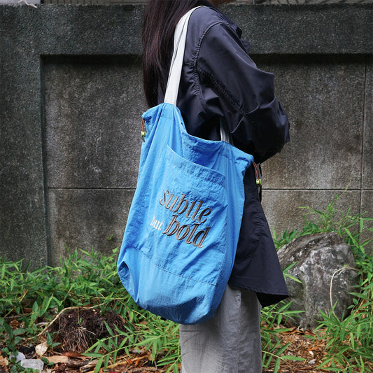 subtle but bold 防潑水天藍抽繩購物袋